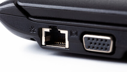 One single ethernet connection port, socket laptop side view macro, extreme closeup Computer internet wired connection, lan network link, data transfer concept Networking abstract, cable not connected