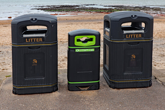 Three public refuse bins on the esplanade at Exmouth in Devon