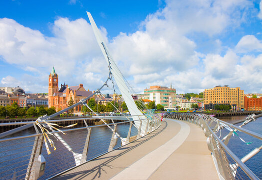 Urban skyline of Derry city (also called Londonderry) in northern Ireland with the famous "Peace Bridge" (Europe - Northern Ireland)