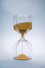hourglass with golden sand pouring inside, eternal time, infinity, business time
