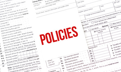 Yellow Paper Note With Words POLICIES, Tax concept