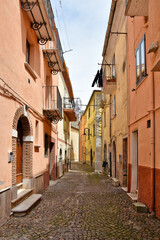 Fototapeta na wymiar A street among the colorful houses of Frosolone, an old town in the Molise region, Italy.