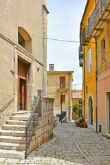 A street among the colorful houses of Frosolone, an old town in the Molise region, Italy.