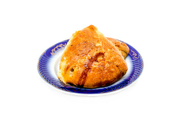 National dish samsa in a plate on a white background. © kvdkz
