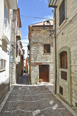 A street among the colorful houses of Frosolone, an old town in the Molise region, Italy.