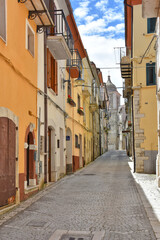 A street among the colorful houses of Frosolone, an old town in the Molise region, Italy.