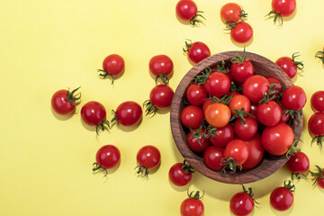 Cherry tomatoes on a yellow background. Food Background Tomatoes