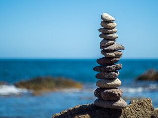 Zen stone pyramid by the mediterranean sea