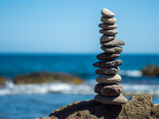 Zen stone pyramid by the mediterranean sea