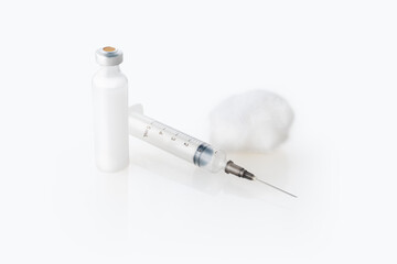 Vaccine Insulin  ampoule and a syringe isolated against white background