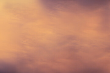 Abstract blurred background of yellow, gold and orange colors, imitation of a blurry sunset