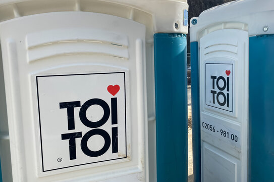 Essen, Germany - February 9. 2020: Closeup of doors with logo lettering of toi toi mobile rental toilettes