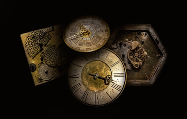 Different old antique watches on the black background. Philosophy image of time transience.