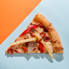 Pizza slice triangle on a colored bright background. Concept for pizzerias