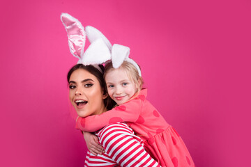 Happy easter family. Happy sister childhood concept. Girls bunny ears Funny little mother kids celebrate. Egg hunt traditional spring holiday.