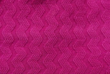 red pink texture of wool fabric on clothes made of sweaters