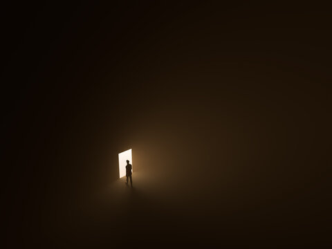 man in front of a open glowing door