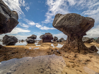 Fototapeta na wymiar Fiji, Taveuni Island. Rock formations on the beach of Lavena showing erosion.
