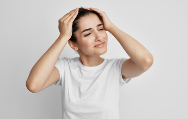 woman holding face headache and migraine health problems