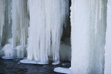Ice hangs down in front of a walkway