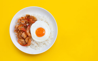 Spicy stir fried prawns with fried egg on rice