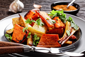 Moroccan roasted parsnip and carrot on a plate - obrazy, fototapety, plakaty