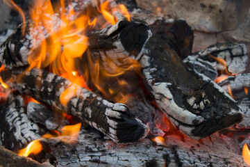 Burning charcoal. The embers are bright red.