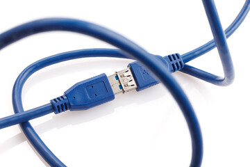 Blue USB 3.0 of power and data extension cable isolated on white background. Closeup