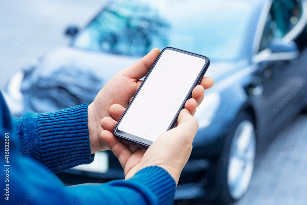 Poster mock-up of a smartphone in the hands of a man against the background of a car.