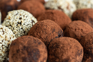 truffles with cocoa, coconut and sesame seeds with chocolate and marshmallows, delicious dessert