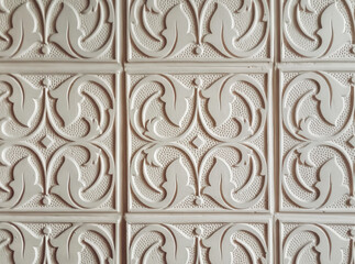 Plaster white ornament with floral elements. Wall decoration concept. Vintage background.