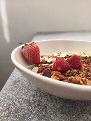 bowl of muesli with strawberries