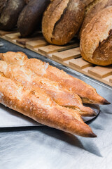 Craft bread on the table at the bakery. The concept of small industries and healthy food