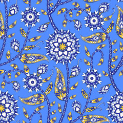 Seamless floral pattern in indian paisley tradition. Oriental print with symbolic mandala flowers. Ornate lace geometric round inflorescence on blue background