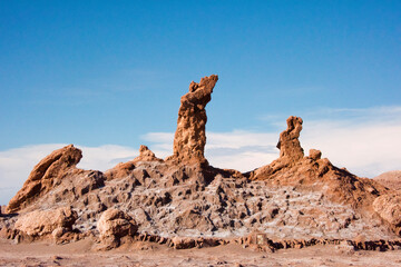 Fototapeta na wymiar Rock formation named 'Tres Marias' in Valle de la Luna (Moon Valley), San Pedro de Atacama, Antofagasta Region, Chile