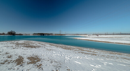 Hollener Bavarian lake during winter time with sun and blue sky background