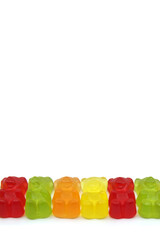 Colourful gummy bears candies isolated on white background. Fun candy macro shot. Copy space for...