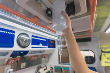 a sanitary prepares an ambulance to go out and do an emergency service © Javier Gea