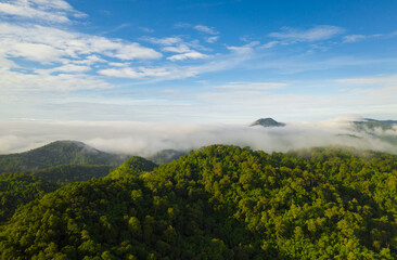 Fototapeta premium Aerial view Beautiful of morning scenery sea of cloud and the fog flows on high mountains.
