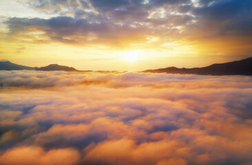 Fototapeta na wymiar Aerial view Beautiful of morning scenery sea of cloud and the fog flows on high mountains.