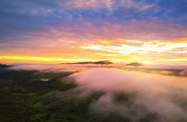 Aerial view Beautiful of morning scenery sea of cloud and the fog flows on high mountains.