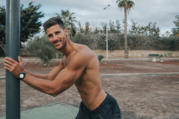 young man exercises with face mask outdoors