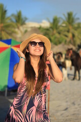 Portrait of a beautiful young woman on the beach