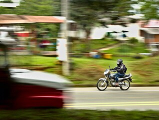 Obraz na płótnie Canvas motorcyclist caught in motion