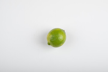 Single ripe lime fruit isolated on white background