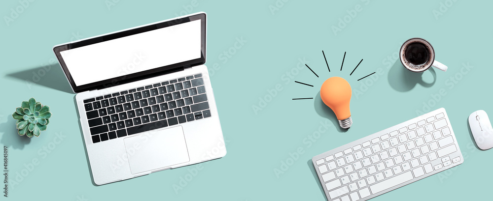 Poster computers with a light bulb from above