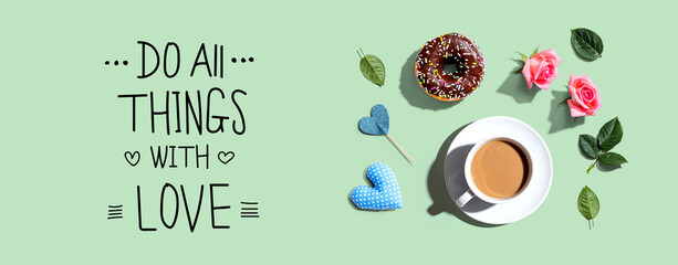 Do all things with love message with a cup of coffee and a donut - flat lay