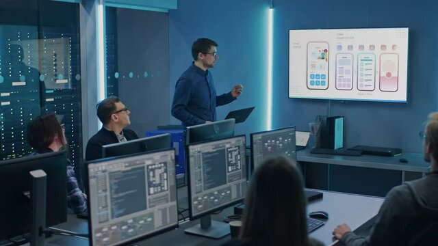 Tech Department Conference Room Meeting: IT Specialist Doing Food Delivery Software App Presentation to a Diverse Team of Engineers, Professionals, Explaining UI UX Working, Customer Support