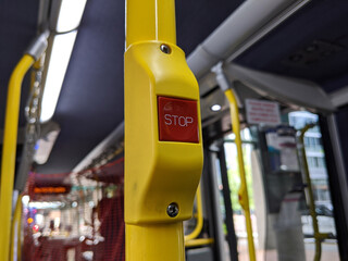 a red 'Stop' button inside a metro bus in Seattle