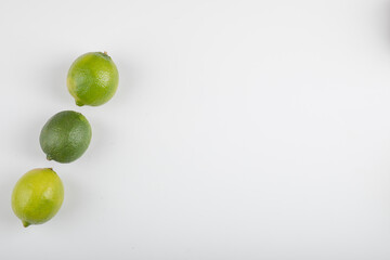 Three ripe lime fruits isolated on white background